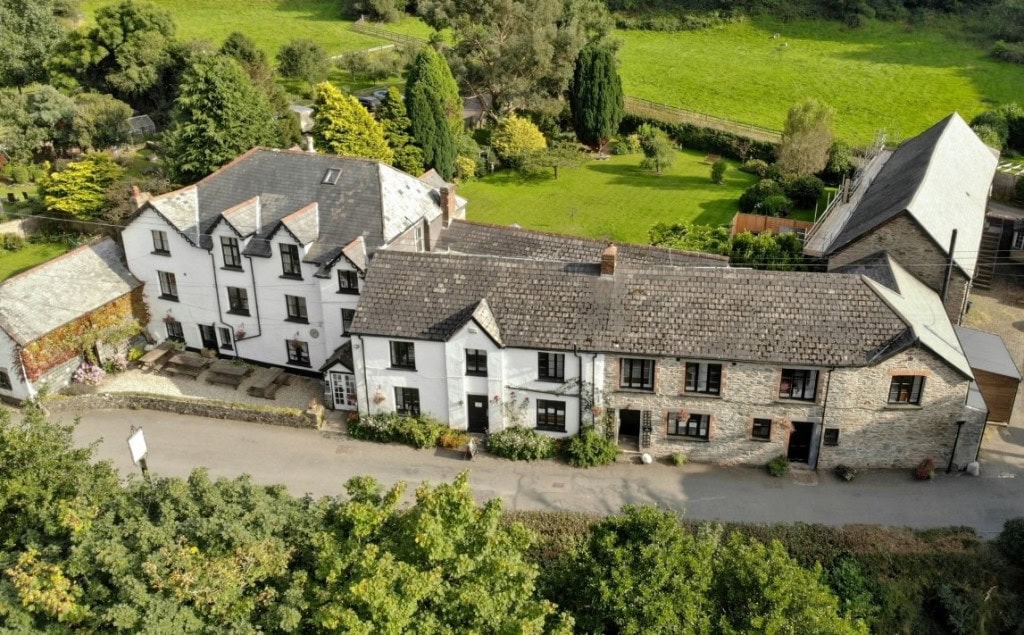 Quaint traditional cottages with lush gardens in Little Switzerland, Exmoor National Park.