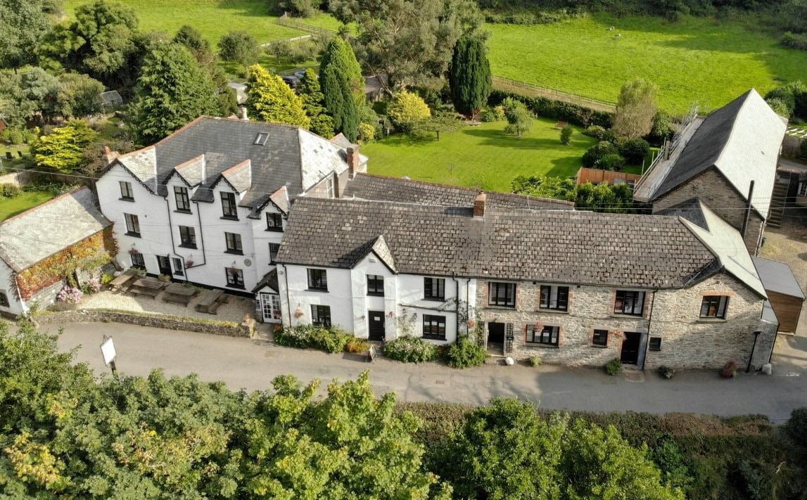 Quaint traditional cottages with lush gardens in Little Switzerland, Exmoor National Park.