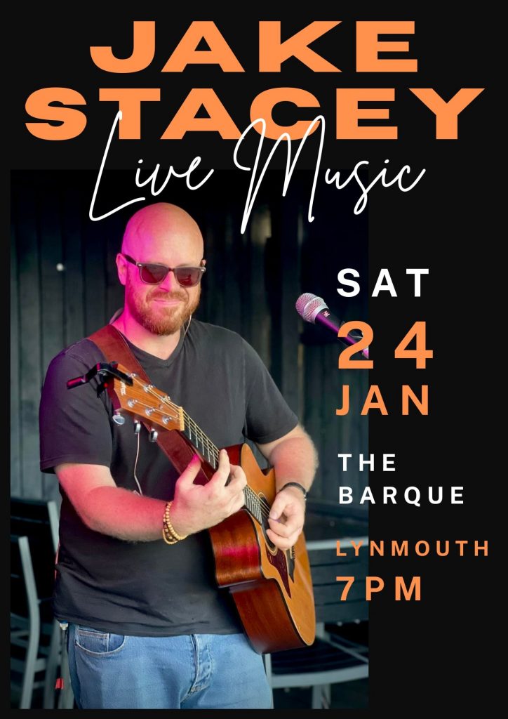 A musician playing guitar during a live performance at The Barque in Lynmouth, North Devon.