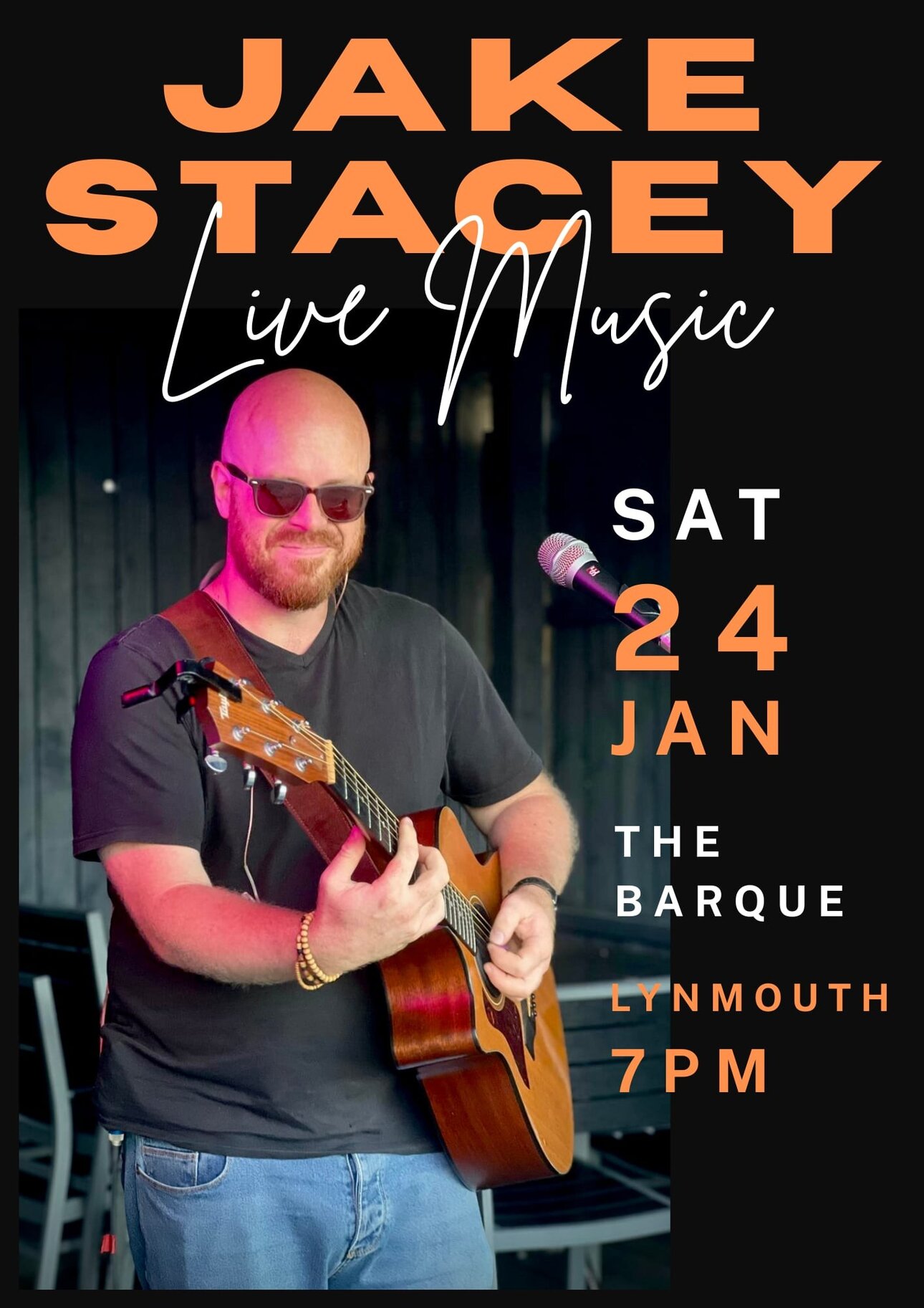 A musician playing guitar during a live performance at The Barque in Lynmouth, North Devon.
