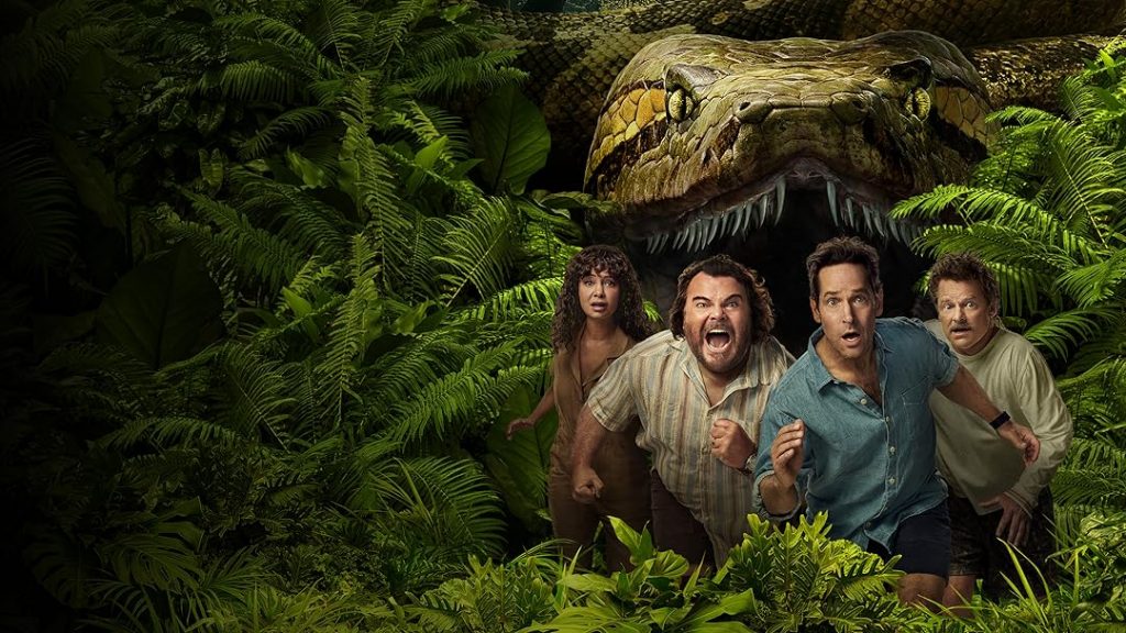 A group of people running from a giant, menacing dinosaur in lush jungle foliage.