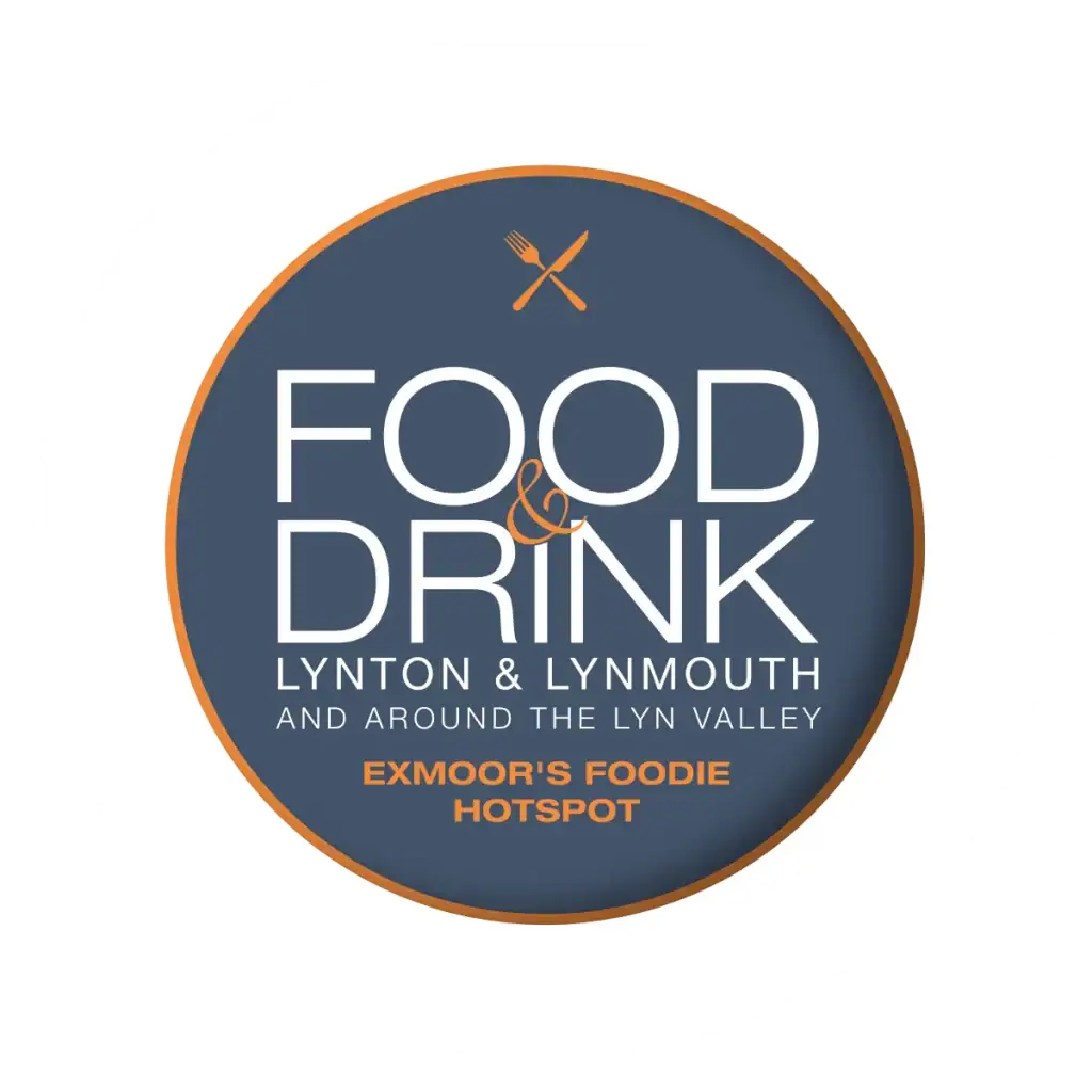 Scenic view of Lynton and Lynmouth with lush green hills and the coast in the background.