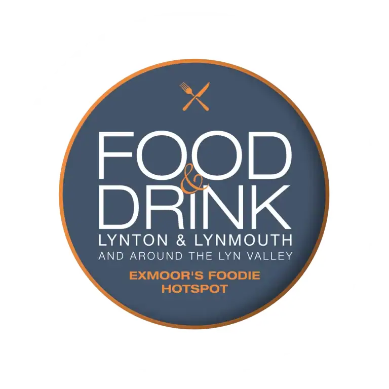 Scenic view of Lynton and Lynmouth with lush green hills and the coast in the background.