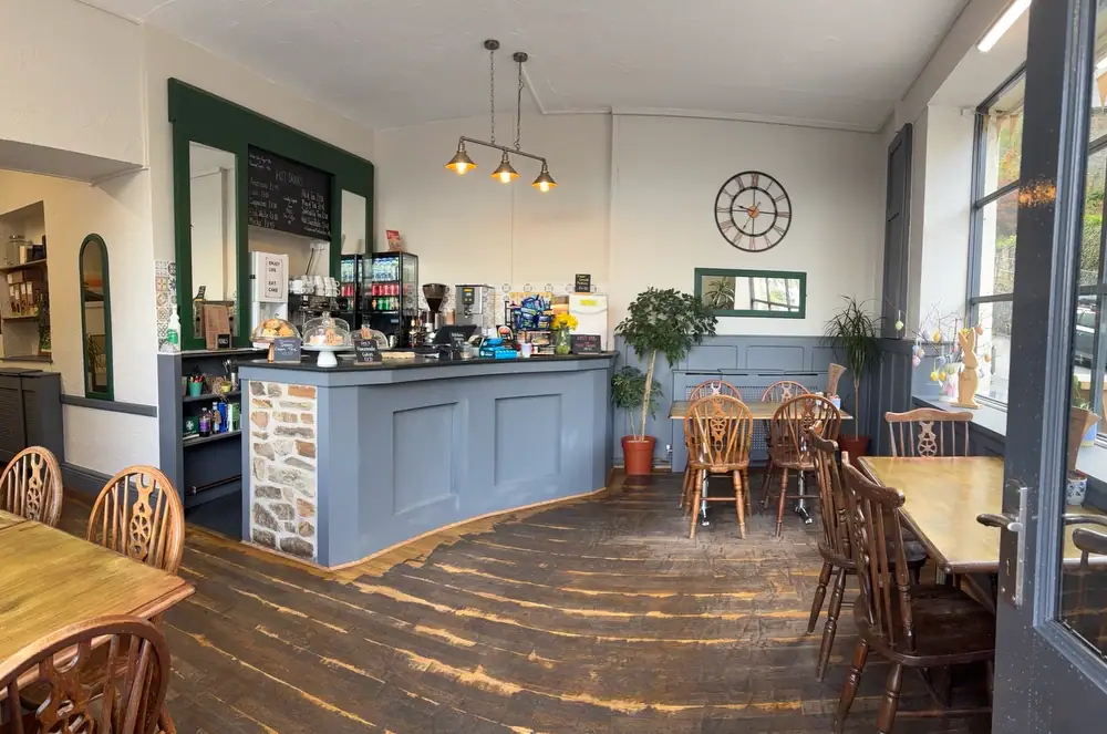 Lyndale Tea Rooms, a Charming café with wooden tables and chairs, large windows, and a welcoming atmosphere in Lynmouth