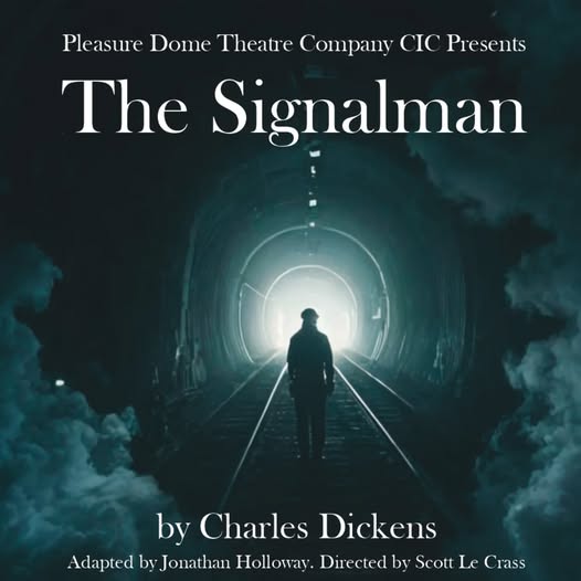 A solitary figure stands on railway tracks inside a dark tunnel, illuminated by a mysterious light a.